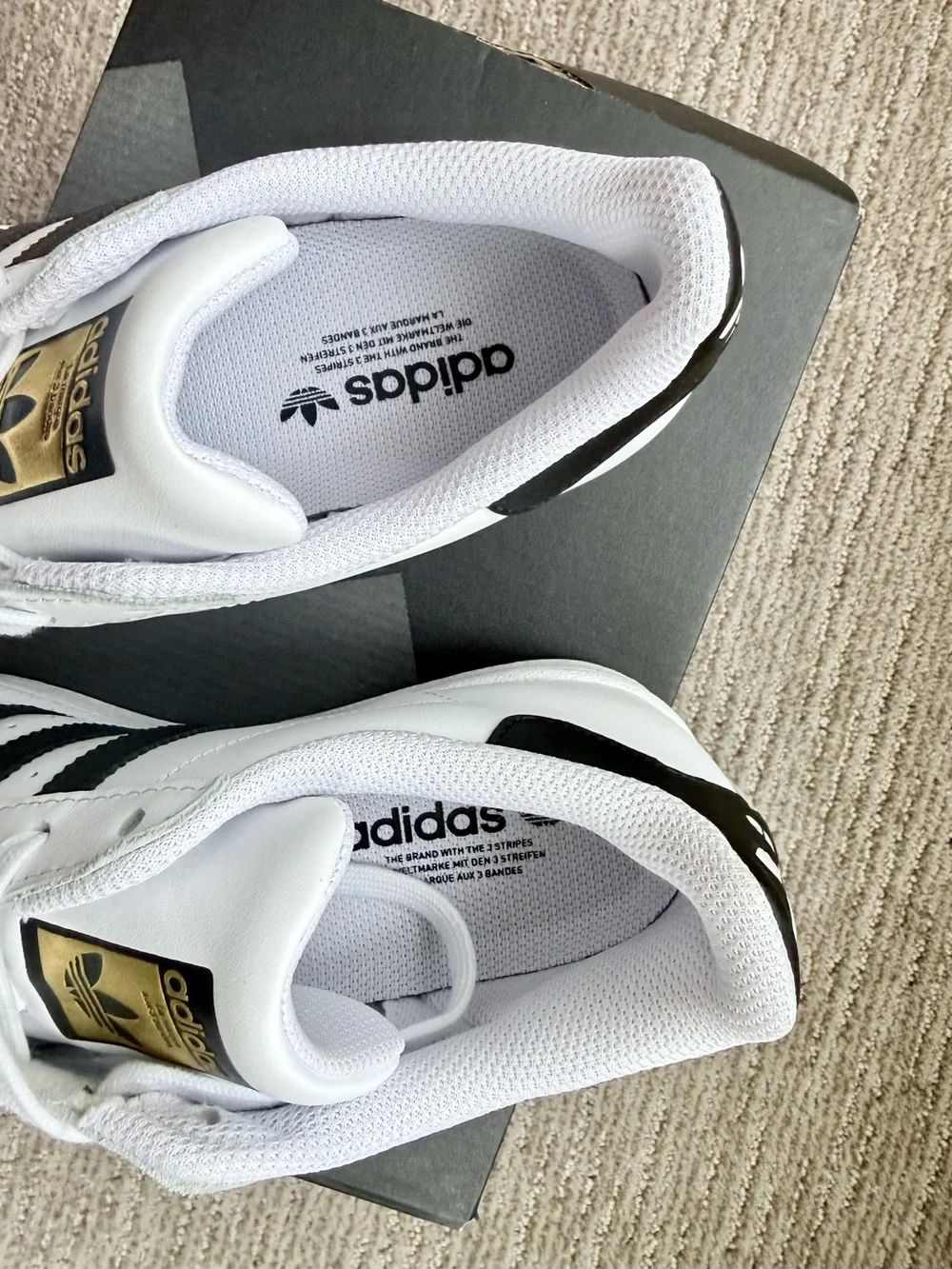 adidas White/Black Superstar Leather Sneaker with Gold Accents